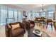 Cozy living room featuring comfortable seating, modern decor, and ample natural light at 21261 E 60Th Ave, Aurora, CO 80019