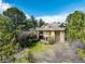 Aerial view of a grand home surrounded by mature trees and landscaping at 648 Ruby Trust Dr, Castle Rock, CO 80108