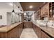 Well-equipped bar and entertainment area featuring custom cabinets, stone accents, and a cozy atmosphere at 648 Ruby Trust Dr, Castle Rock, CO 80108