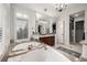 This bathroom includes a soaking tub, dual sinks, and a glass-enclosed shower at 648 Ruby Trust Dr, Castle Rock, CO 80108