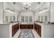 A luxurious bathroom features dual sinks, a soaking tub, and custom cabinetry at 648 Ruby Trust Dr, Castle Rock, CO 80108