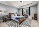 The bedroom features a cozy sitting area and a window offering great natural light at 648 Ruby Trust Dr, Castle Rock, CO 80108