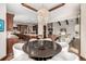 Open concept dining area showcasing a stunning chandelier and seamless flow into the kitchen and living room at 648 Ruby Trust Dr, Castle Rock, CO 80108