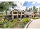 Stunning two-story home with stone accents, a well-manicured lawn, and a winding driveway at 648 Ruby Trust Dr, Castle Rock, CO 80108