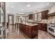 Spacious kitchen with custom cabinets, a large island, and ample counter space for food preparation at 648 Ruby Trust Dr, Castle Rock, CO 80108