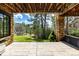 Spacious outdoor patio with stone columns and views of the surrounding greenery at 648 Ruby Trust Dr, Castle Rock, CO 80108