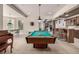 Entertainment area offering pool table, breakfast nook, bar, and lots of space at 648 Ruby Trust Dr, Castle Rock, CO 80108