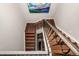 This home features an open wooden staircase with a decorative wrought iron railing at 648 Ruby Trust Dr, Castle Rock, CO 80108