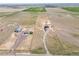 Expansive land with a residence and workshop, set amidst rolling plains under a vast sky at 49346 E County Road 6, Bennett, CO 80102