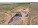 Stunning aerial view of a charming home nestled in a vast, open landscape with ample land at 49346 E County Road 6, Bennett, CO 80102