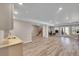 Finished basement with modern flooring, neutral colors, and walk out access at 49346 E County Road 6, Bennett, CO 80102