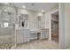 Gorgeous bathroom featuring dual sinks, granite countertops, and a walk-in shower at 49346 E County Road 6, Bennett, CO 80102