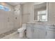 Bright bathroom with a glass shower, tile floors and granite vanity at 49346 E County Road 6, Bennett, CO 80102
