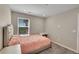 Comfortable bedroom with plush carpeting, natural light, and a minimalist design at 49346 E County Road 6, Bennett, CO 80102