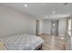 Bright bedroom with laminate flooring, neutral tones, and a view of the outside at 49346 E County Road 6, Bennett, CO 80102