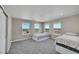 Bright secondary bedroom featuring neutral walls, carpeted floors and ample sunlight at 49346 E County Road 6, Bennett, CO 80102