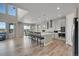 Large kitchen with a spacious island with bar stool seating and stainless steel appliances at 49346 E County Road 6, Bennett, CO 80102