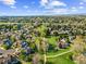 Overhead view showcasing a community with lush green spaces, walking paths, and picturesque homes at 10915 Acadia Ln, Parker, CO 80138