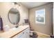 Cozy bathroom featuring a vanity, toilet, and shower/tub combination at 10915 Acadia Ln, Parker, CO 80138