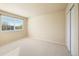 Neutral bedroom with a window and closet provides a calm and inviting space at 10915 Acadia Ln, Parker, CO 80138