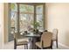 Cozy dining area featuring a bay window with scenic views and a stylish round table with seating for four at 10915 Acadia Ln, Parker, CO 80138