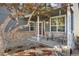 Cozy front porch with stone accents, comfortable seating, and tasteful landscaping creating an inviting entrance at 10915 Acadia Ln, Parker, CO 80138