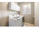 Laundry room with white cabinets and appliances at 10915 Acadia Ln, Parker, CO 80138