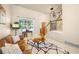 Inviting living room with a staircase, large window, and stylish decor creating a comfortable and elegant atmosphere at 10915 Acadia Ln, Parker, CO 80138