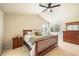 Comfortable main bedroom with natural light, ceiling fan, and carpeted floors at 10915 Acadia Ln, Parker, CO 80138