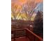 Scenic sunset view from the deck with beautiful trees and calming colors at 10915 Acadia Ln, Parker, CO 80138