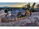 This home has a large backyard with an outdoor living space including a patio and hot tub at 20243 High Pines Dr, Monument, CO 80132