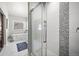 Modern bathroom with walk-in shower, decorative tile accent, and soaking tub with fixtures at 20243 High Pines Dr, Monument, CO 80132