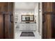 Elegant bathroom featuring double vanity sinks, white cabinetry, and a large framed mirror at 20243 High Pines Dr, Monument, CO 80132