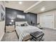 Bedroom featuring a bed with patterned accent wall and minimalist decor at 20243 High Pines Dr, Monument, CO 80132