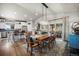 Open concept kitchen and dining area featuring hardwood floors and sliding door to the backyard at 20243 High Pines Dr, Monument, CO 80132