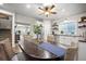 Dining area with wood table and chairs; opens to updated kitchen with white cabinetry at 20243 High Pines Dr, Monument, CO 80132