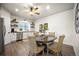 Dining area includes kitchen, wood table and chairs with a ceiling fan at 20243 High Pines Dr, Monument, CO 80132