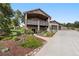 Lovely exterior of two-story home with a large deck, landscaping, and a three-car garage at 20243 High Pines Dr, Monument, CO 80132