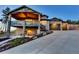 Beautiful two-story home featuring a deck with stone supports and a spacious three-car garage at 20243 High Pines Dr, Monument, CO 80132