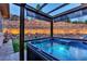 Relaxing hot tub area with stone retaining wall in backyard at 20243 High Pines Dr, Monument, CO 80132