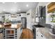 Gourmet kitchen boasts stainless steel appliances, granite counters, and a stylish backsplash at 20243 High Pines Dr, Monument, CO 80132