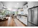 Spacious kitchen with stainless steel appliances, white cabinetry, and views to the living area at 20243 High Pines Dr, Monument, CO 80132