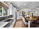 Bright kitchen with stainless steel appliances, large island with seating, and a view outside at 20243 High Pines Dr, Monument, CO 80132