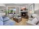 Inviting living room with stone fireplace, comfortable furniture and a large window at 20243 High Pines Dr, Monument, CO 80132
