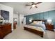 Serene main bedroom featuring paneled accent wall, plush bedding, and stylish furnishings at 20243 High Pines Dr, Monument, CO 80132