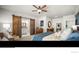 Comfortable main bedroom with sliding barn door to ensuite bath and elegant decor at 20243 High Pines Dr, Monument, CO 80132