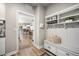 Mudroom features a bench with storage and an open doorway leading into the kitchen at 20243 High Pines Dr, Monument, CO 80132