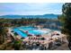 Community pool features a large swimming area, waterslide, and comfortable lounge chairs at 20243 High Pines Dr, Monument, CO 80132
