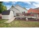 Charming backyard with a shed, wooden deck, and beautiful landscaping, providing a serene outdoor space at 12104 Ivanhoe Ct, Brighton, CO 80602