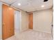 Carpeted bedroom with neutral colors and a door leading to another room at 12104 Ivanhoe Ct, Brighton, CO 80602